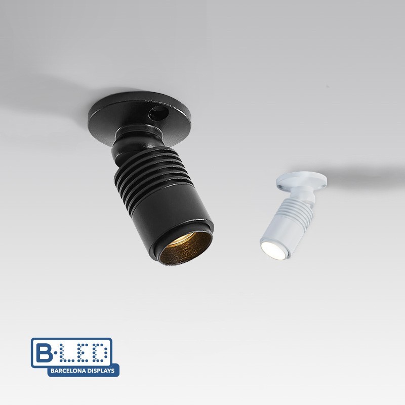 Spot de surface en aluminium laqué de finition mate, en noir ou en blanc. Spot de surface en aluminium laqué de finition mate, en noir ou en blanc.