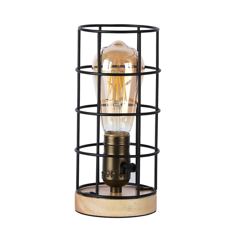 Lampe de table un abat-jour cylindrique en torsades de métal monté sur pieds  croisés en bois de style industriel rétro
